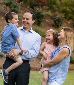 photo of parents and kids having fun in their backyard