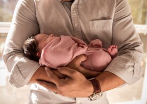 baby girl in dads arms