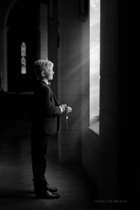Roswell first communion portraits boy by window