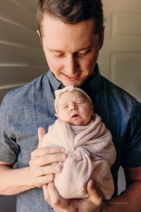 marietta in-home newborn photographer dad and baby