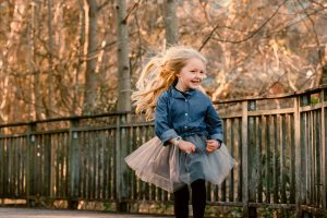 portrait of a young girl running