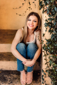 Roswell senior photos in yellow staircase area