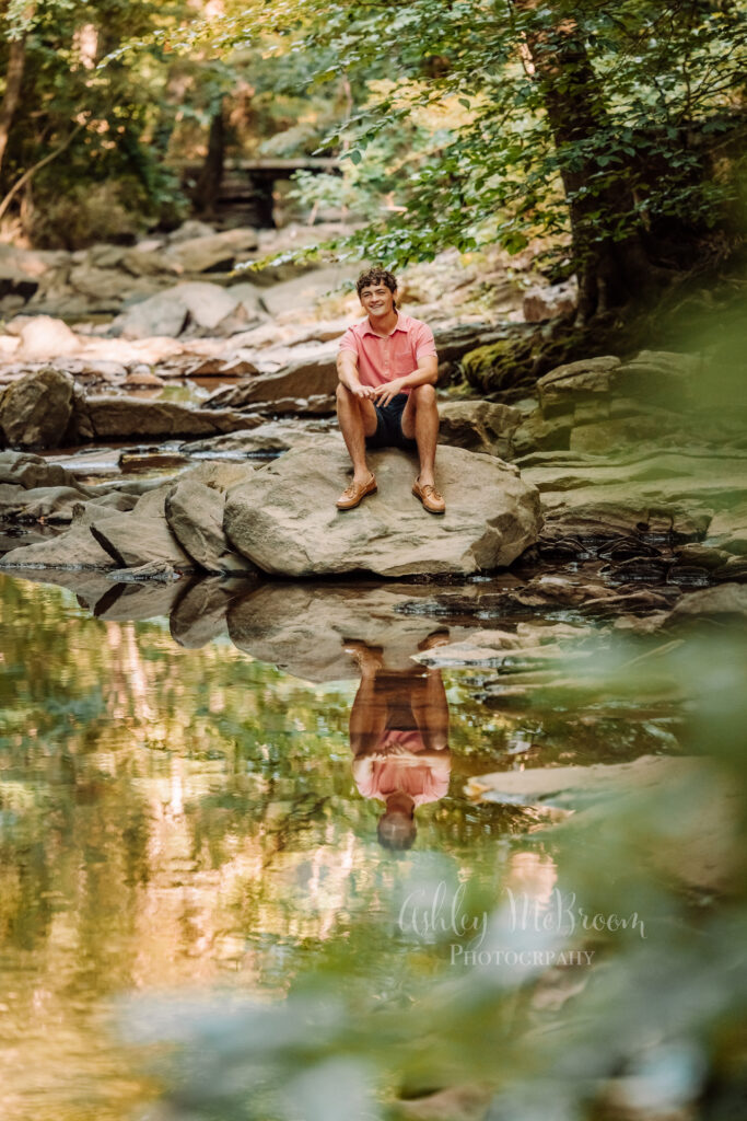Creative outdoor senior portrait with reflection in a Marietta creek
