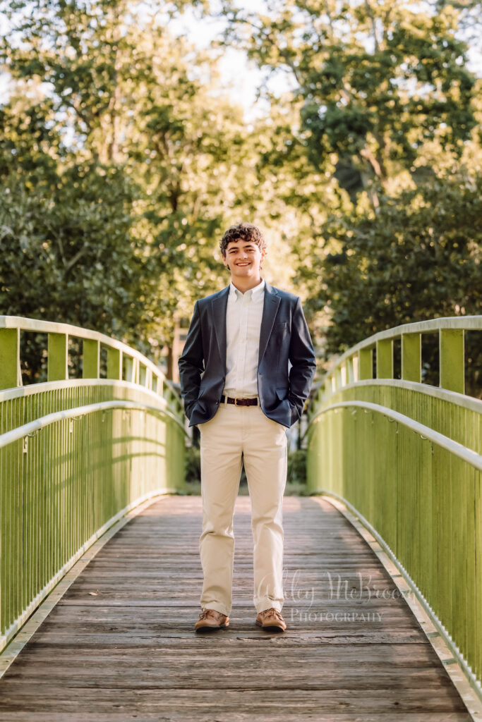 East Cobb senior photographer portrait of high school senior on a bridge