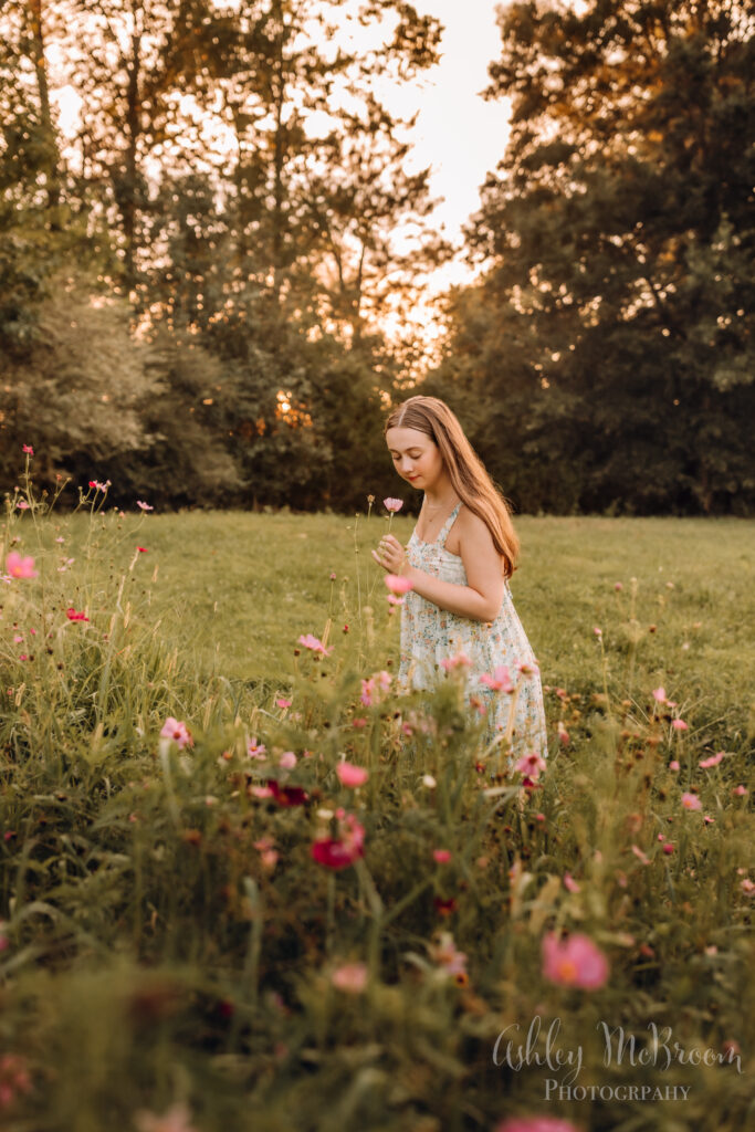 stopping to pick the flowers during a photo session
