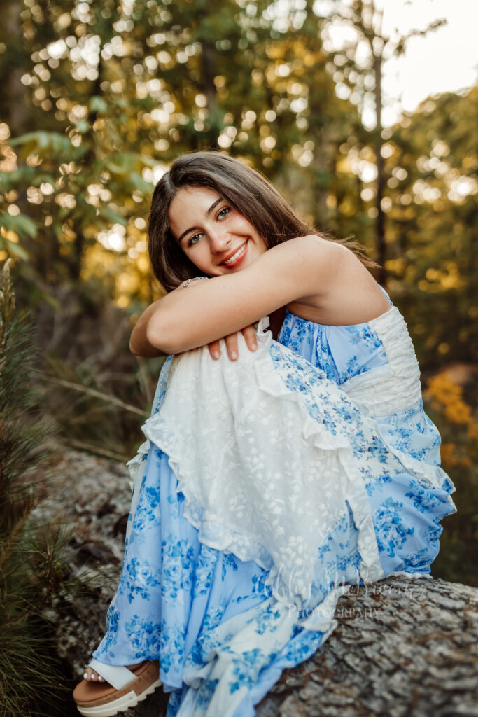 Creekview High School senior portrait in a blue floral dress at sunset