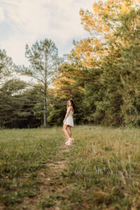 Golden hour senior pictures in a field in Canton, Georgia