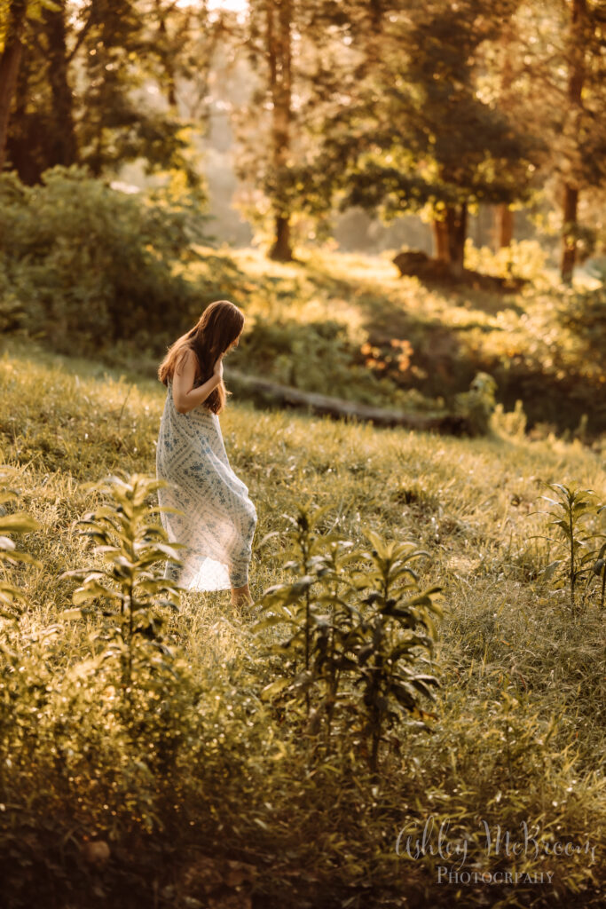 Atlanta senior session with girl walking through backlit field