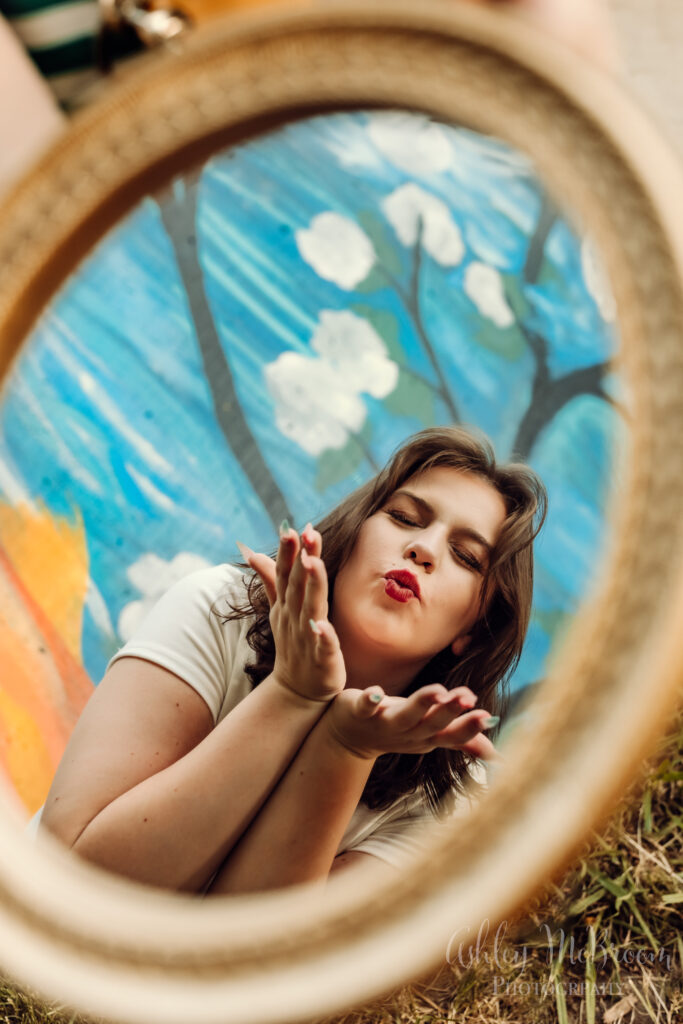 unique senior pictures with a mirror pose in downtown Atlanta