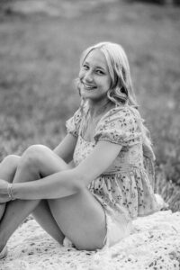 Black and white senior portrait of a Pope High School senior during her outdoor session