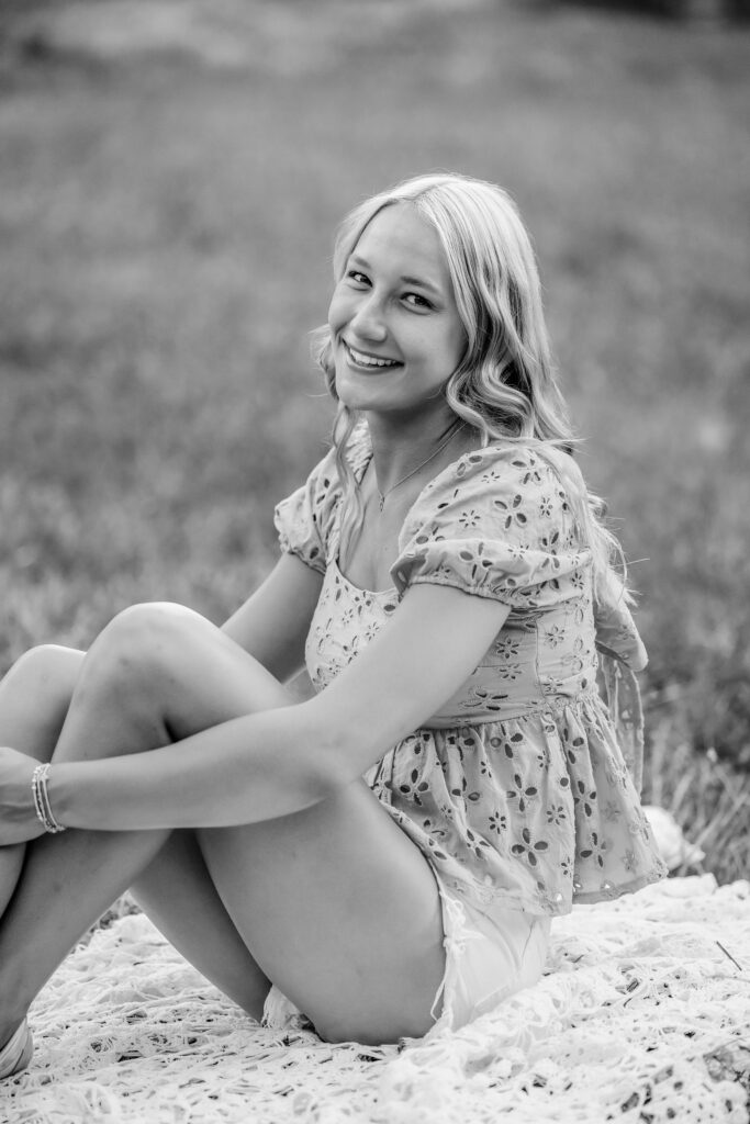 Black and white senior portrait of a Pope High School senior during her outdoor session