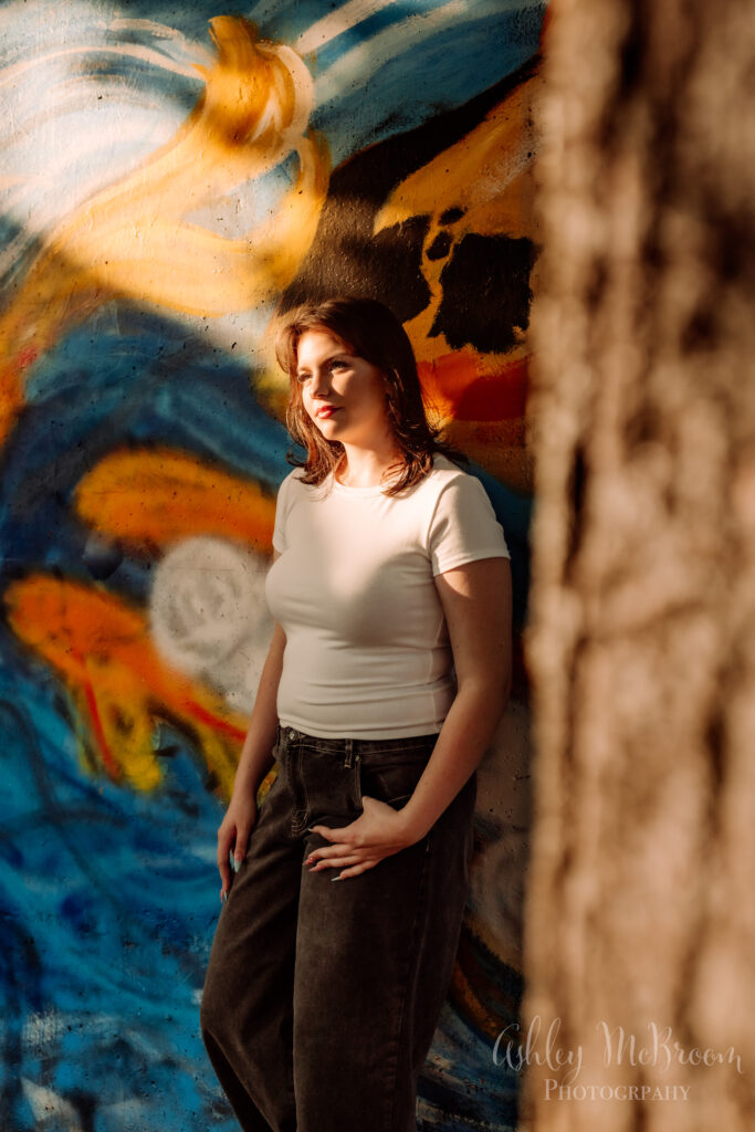 artistic and creative lighting at mural wall for senior pictures