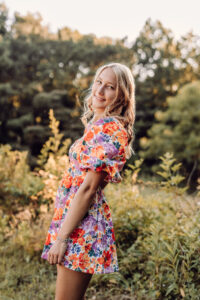 Pope High School senior portrait in a colorful floral dress outdoors in Marietta, Georgia