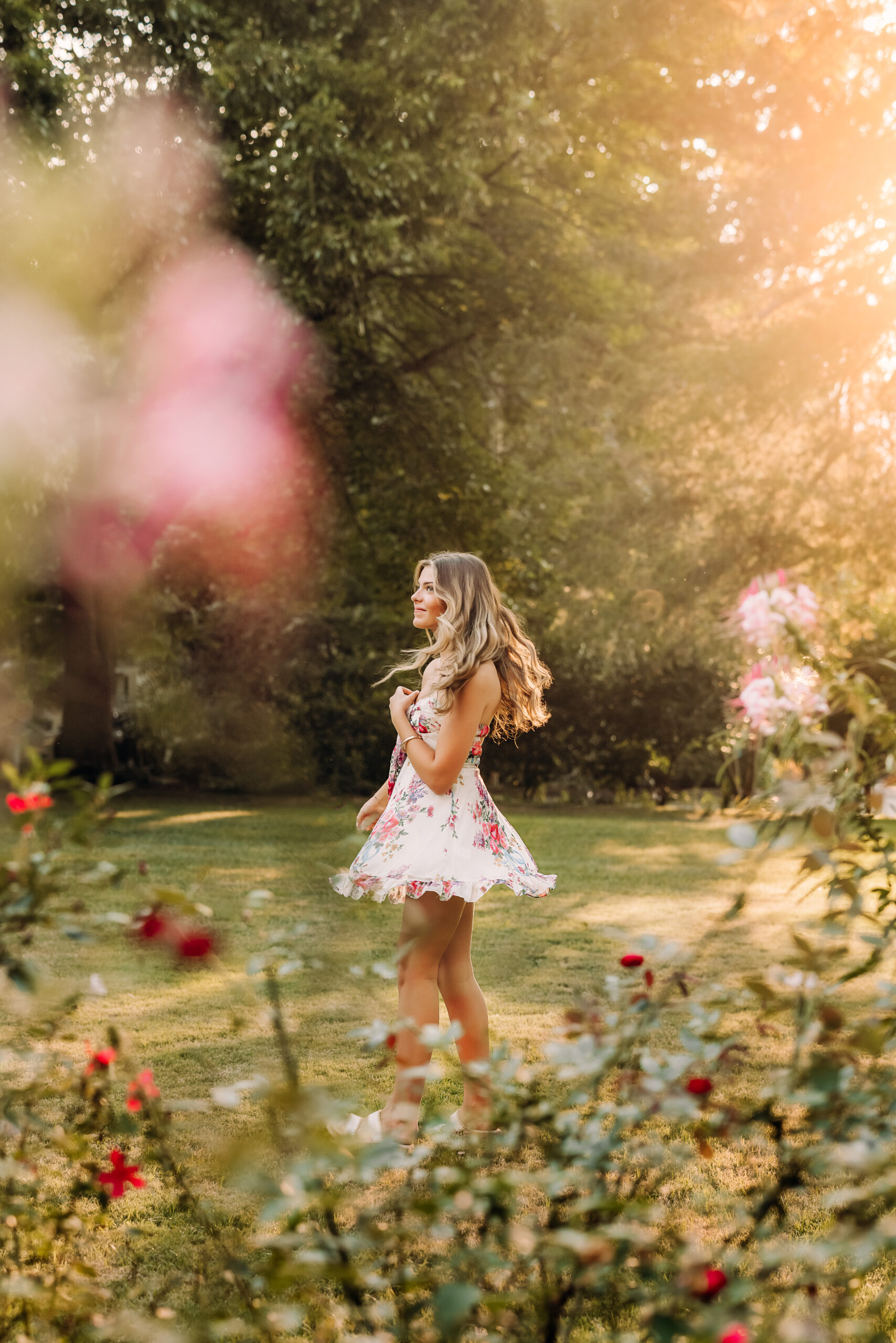 Roswell high school senior twirling in a garden for her senior pictures