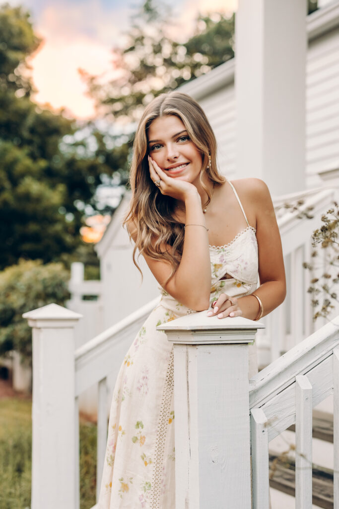 Roswell High School senior photos at Barrington Hall using the white porches to pose