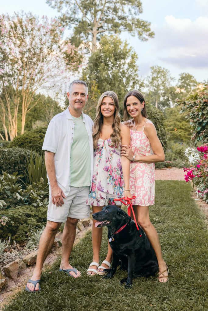 Roswell high school senior with parents and pet dog during her portraits at Barrington Hall