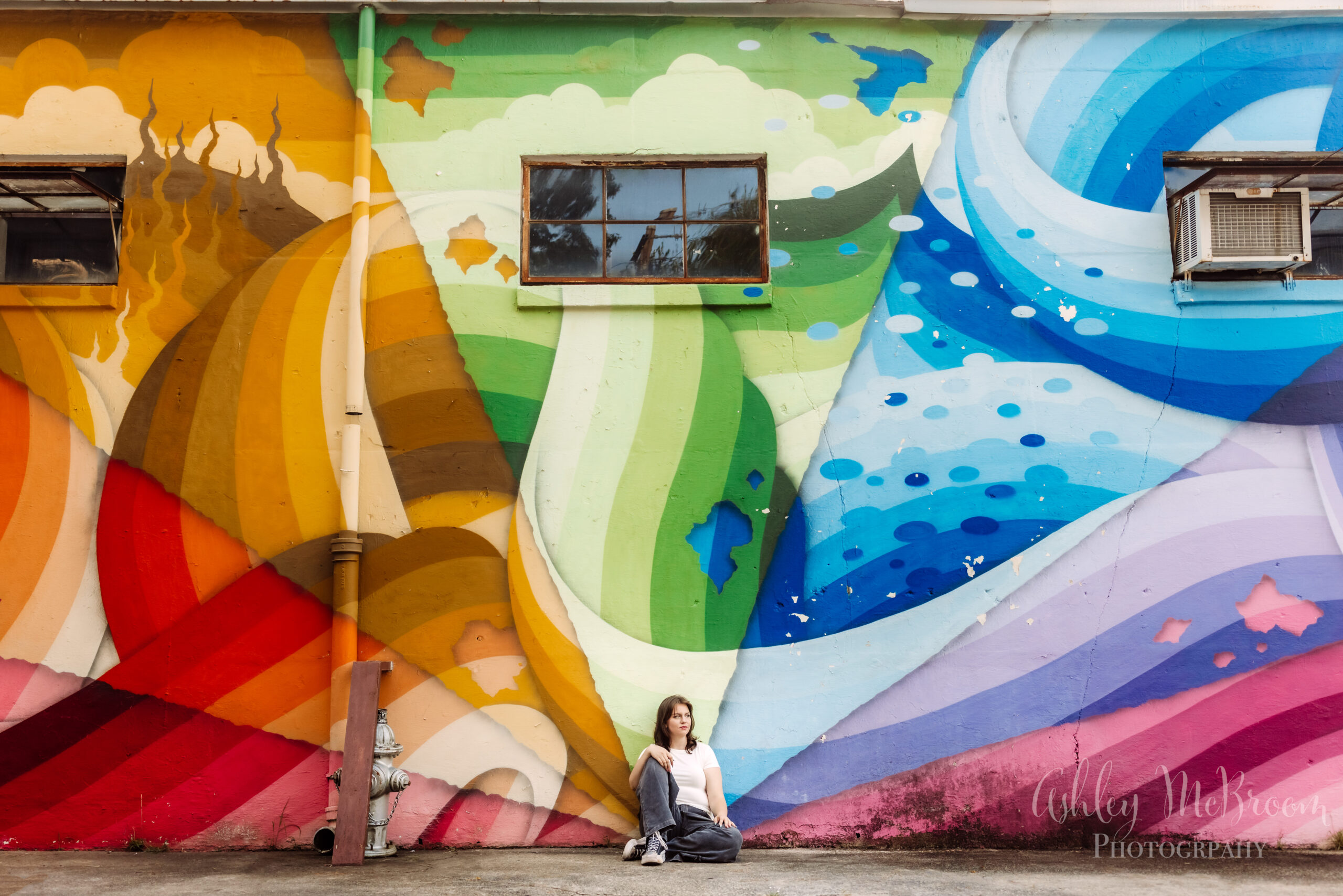 Unique senior pictures Atlanta with colorful murals during an urban senior portrait session