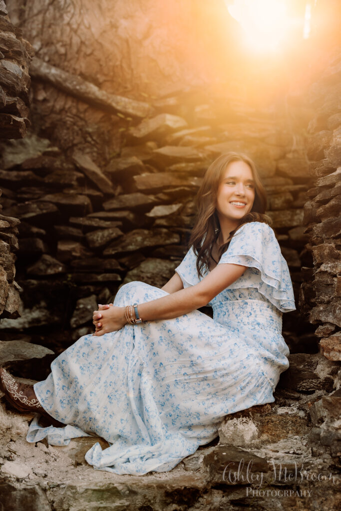 golden hour senior portraits for Walton high school in old paper mill ruins