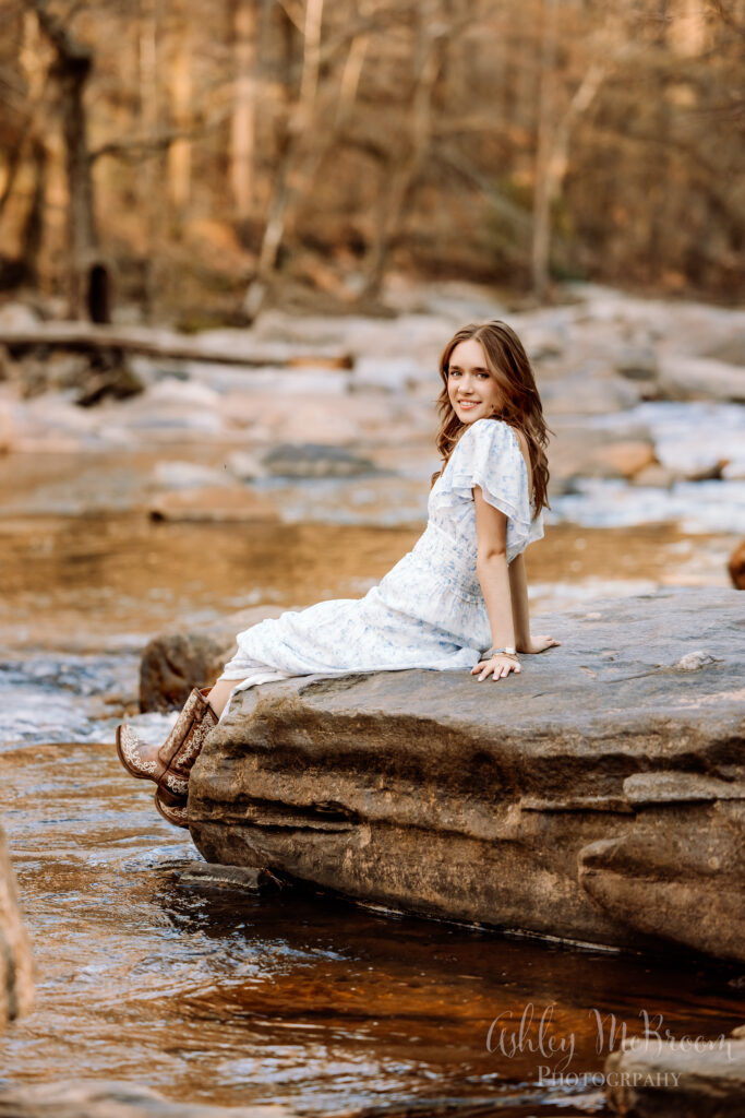 Walton High School senior on beautiful creek rock